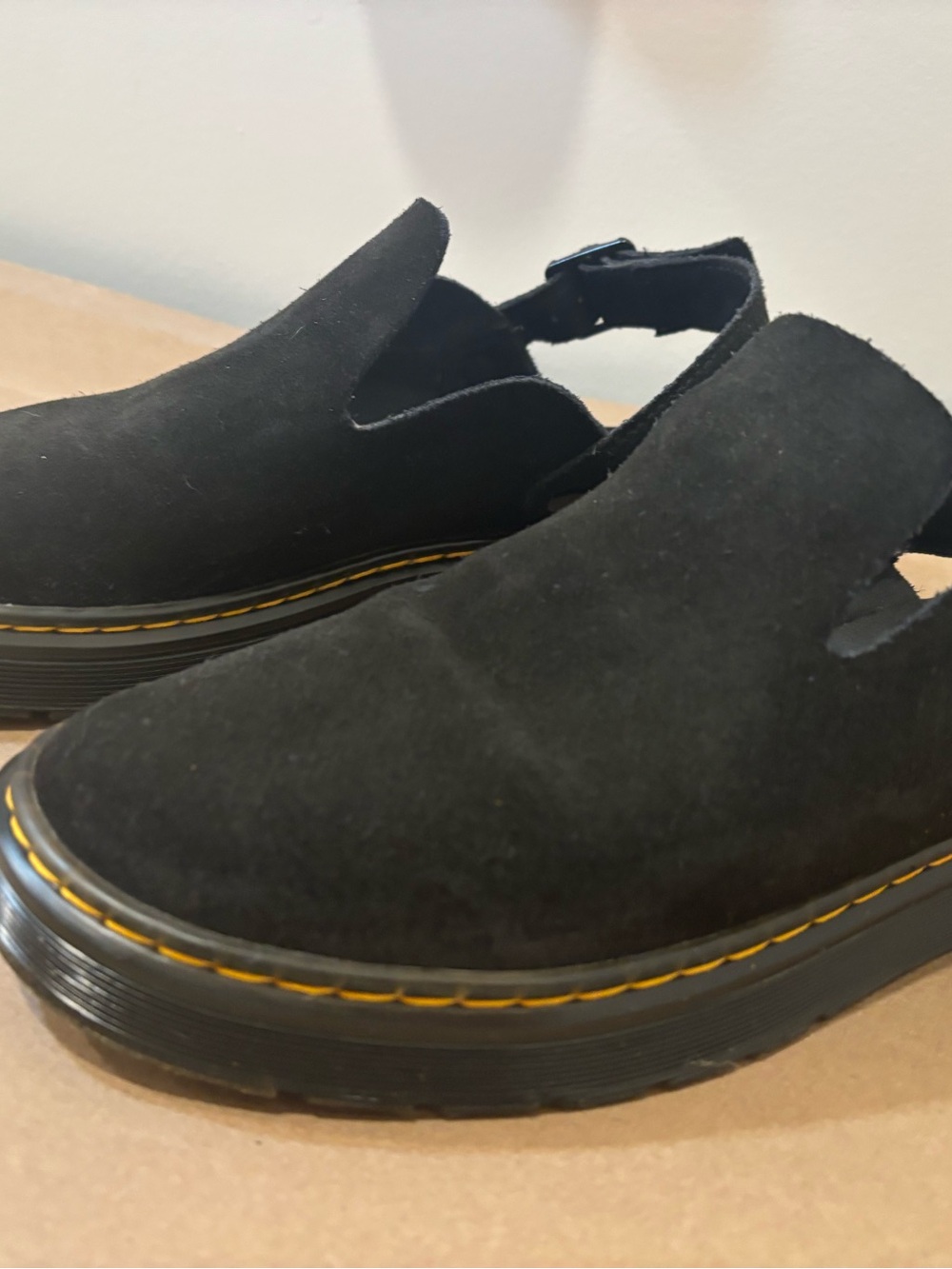 Unisex Dr. Martens Black Suede Slip-On Loafers with Yellow Stitching.